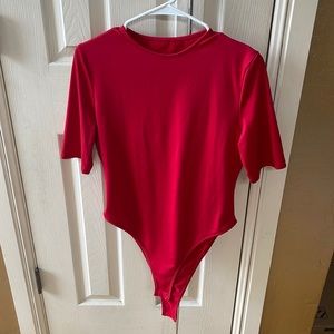New, never been worn, red body suit top.